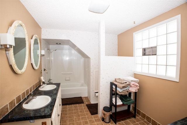 706 Locust St, Anaconda, MT 59711 - bathroom with double vanity, washtub / shower combination, a textured ceiling, and tile patterned flooring
