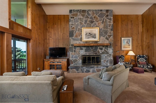 1520 Black Bull Trl, Bozeman, MT 59718 - carpeted living area with wooden walls and a stone fireplace
