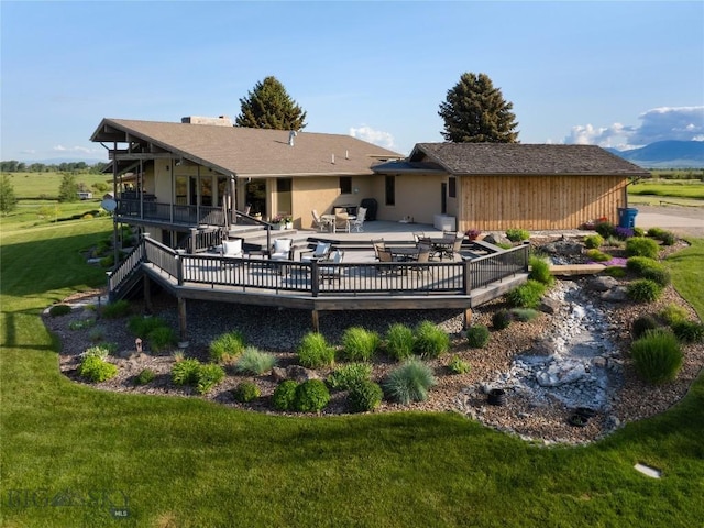 1520 Black Bull Trl, Bozeman, MT 59718 - rear view of property featuring a deck and a yard