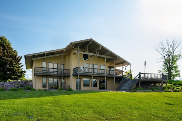 1520 Black Bull Trl, Bozeman, MT 59718 - back of house with stucco siding, a wooden deck, a yard, and stairs