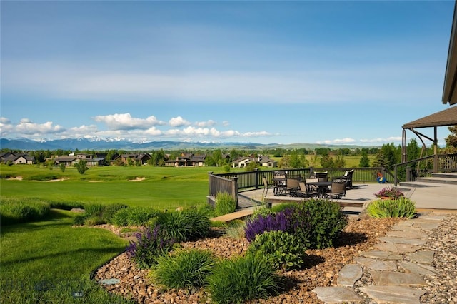 1520 Black Bull Trl, Bozeman, MT 59718 - view of green lawn with a mountain view and outdoor dining area