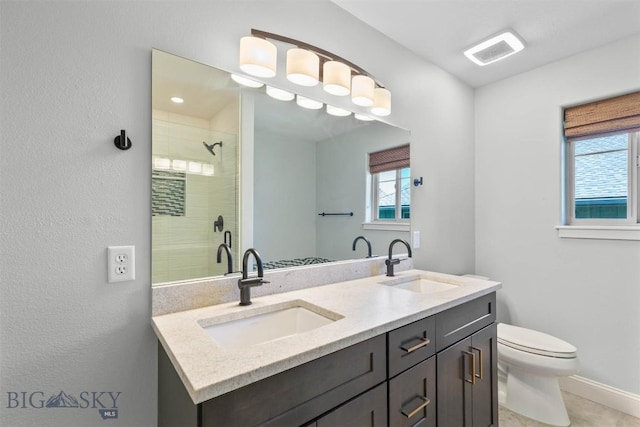 2757 Marlyn Ct Unit 1, Bozeman, MT 59718 - full bathroom with healthy amount of natural light, a shower stall, and double vanity