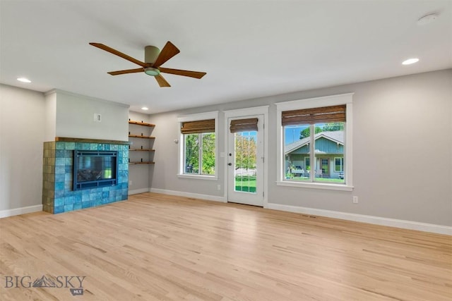 2757 Marlyn Ct Unit 1, Bozeman, MT 59718 - unfurnished living room with ceiling fan, light wood finished floors, recessed lighting, and a tiled fireplace