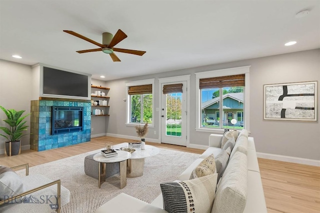 2757 Marlyn Ct Unit 1, Bozeman, MT 59718 - living area with wood finished floors, ceiling fan, recessed lighting, and a fireplace