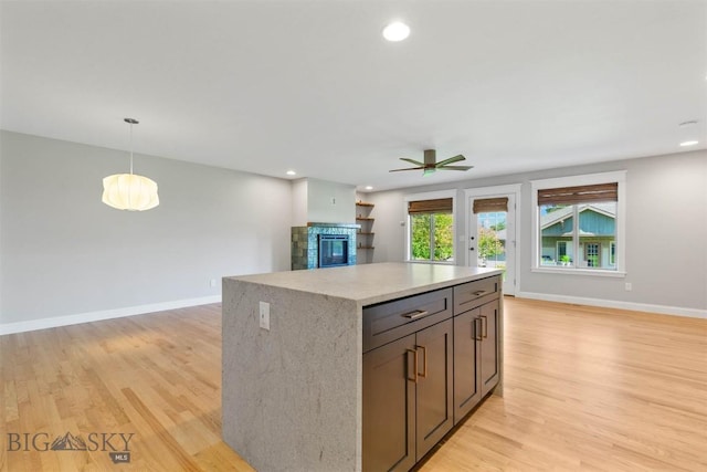 2757 Marlyn Ct Unit 1, Bozeman, MT 59718 - kitchen with a ceiling fan, open floor plan, light wood-style flooring, a center island, and recessed lighting
