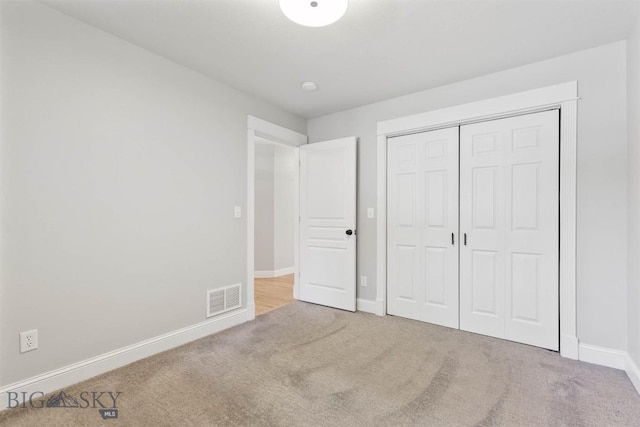2757 Marlyn Ct Unit 1, Bozeman, MT 59718 - unfurnished bedroom featuring carpet floors and a closet