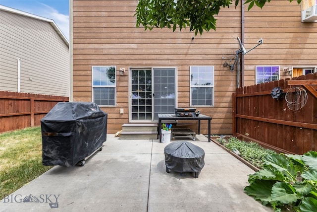 1110 Biehl Unit C, Belgrade, MT 59714 - fenced backyard with a patio area, entry steps, and area for grilling
