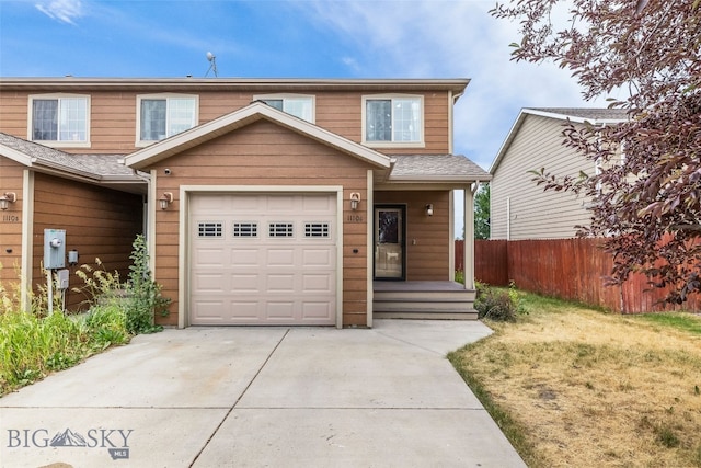 1110 Biehl Unit C, Belgrade, MT 59714 - multi unit property with driveway, an attached garage, and roof with shingles