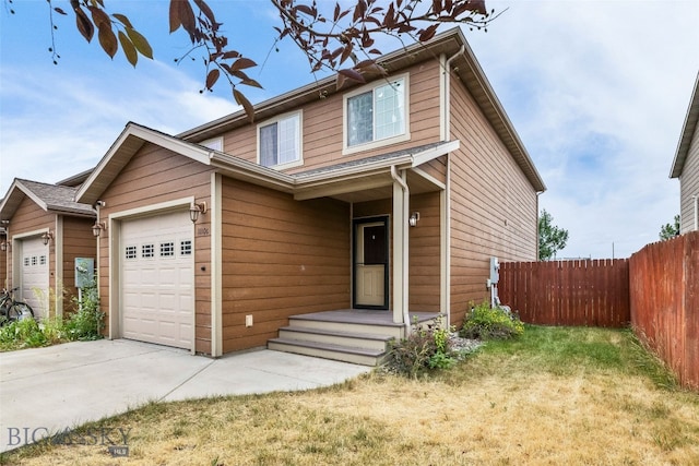 1110 Biehl Unit C, Belgrade, MT 59714 - view of front facade featuring an attached garage and concrete driveway