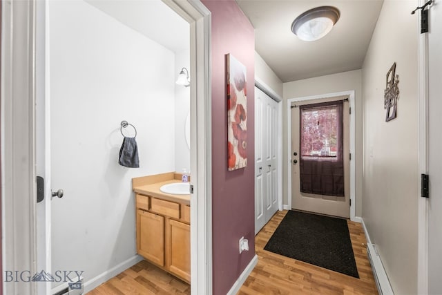 1110 Biehl Unit C, Belgrade, MT 59714 - doorway to outside with light wood-type flooring and baseboards