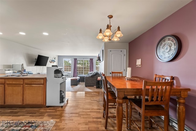 1110 Biehl Unit C, Belgrade, MT 59714 - dining area with light wood-style flooring, a chandelier, recessed lighting, baseboard heating, and an office area