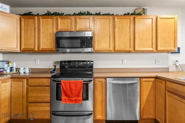 1110 Biehl Unit C, Belgrade, MT 59714 - kitchen with appliances with stainless steel finishes and light countertops