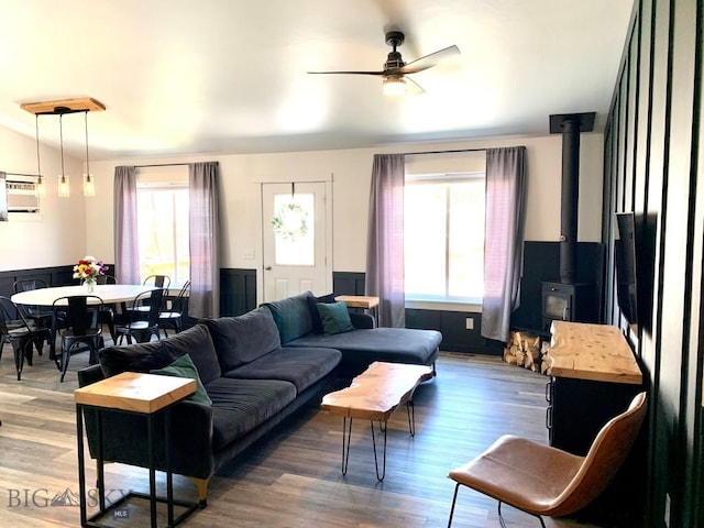 801 Pleiades Pl, Livingston, MT 59047 - living area with a wood stove, ceiling fan, and wood finished floors