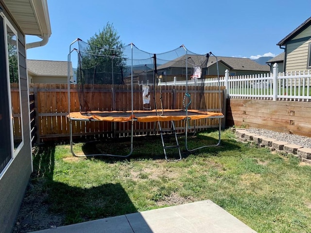 801 Pleiades Pl, Livingston, MT 59047 - fenced backyard featuring a trampoline