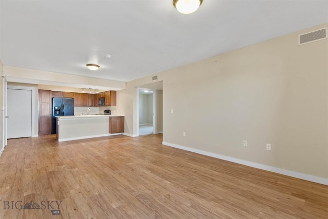 210 S Cottonwood Rd Unit 308, Bozeman, MT 59718 - unfurnished living room with light wood finished floors