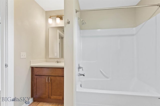 210 S Cottonwood Rd Unit 308, Bozeman, MT 59718 - full bathroom featuring tub / shower combination, vanity, and wood finished floors