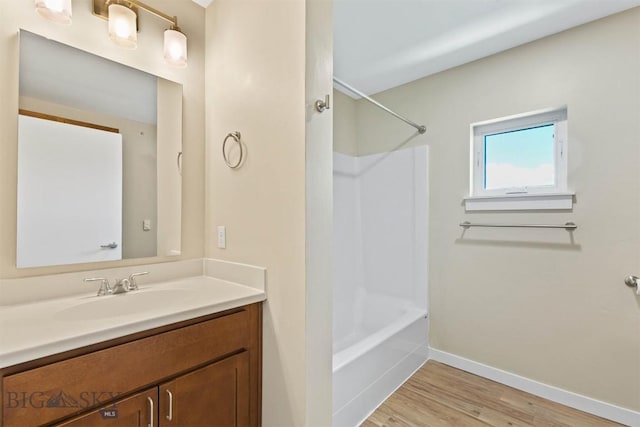 210 S Cottonwood Rd Unit 308, Bozeman, MT 59718 - full bathroom featuring vanity, wood finished floors, and bathtub / shower combination