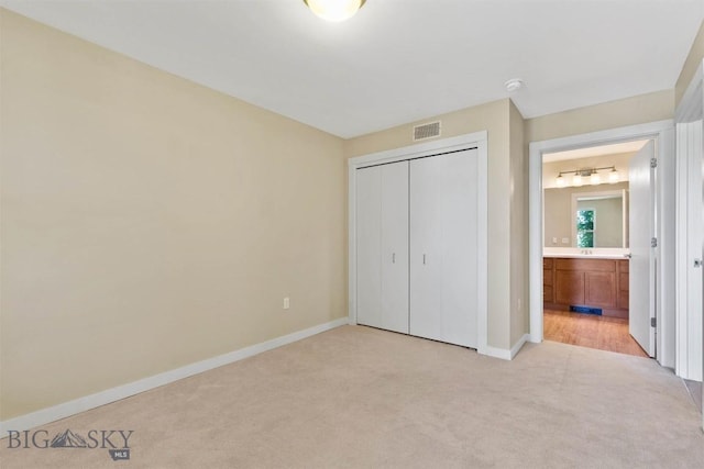 210 S Cottonwood Rd Unit 308, Bozeman, MT 59718 - unfurnished bedroom with light colored carpet, a closet, and ensuite bath