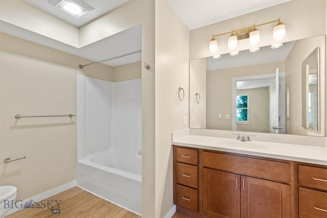 210 S Cottonwood Rd Unit 308, Bozeman, MT 59718 - bathroom with vanity, wood finished floors, and tub / shower combination