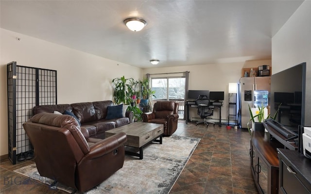 1132 Cruiser Ln Unit F, Belgrade, MT 59714 - living area with dark stone finish floors