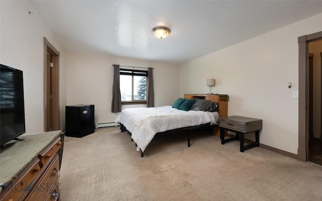 1132 Cruiser Ln Unit F, Belgrade, MT 59714 - bedroom featuring a baseboard heating unit and light colored carpet