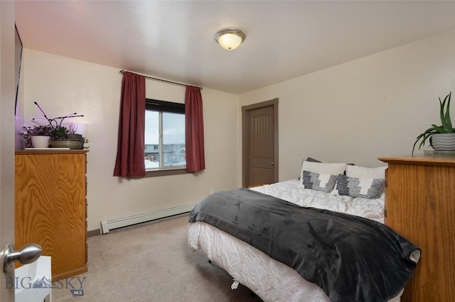 1132 Cruiser Ln Unit F, Belgrade, MT 59714 - bedroom with a baseboard radiator and carpet floors