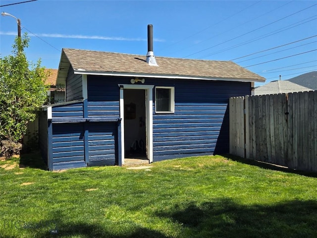 1906 Thomas Ave, Butte, MT 59701 - rear view of property featuring an outdoor structure and a shingled roof