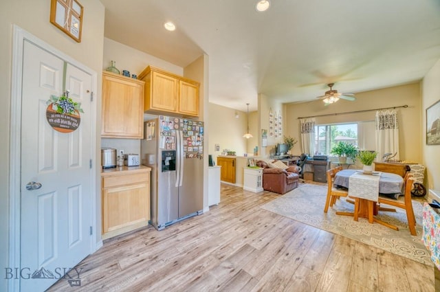215 N 4th St Unit B, Manhattan, MT 59741 - kitchen featuring stainless steel refrigerator with ice dispenser, light brown cabinets, light wood-style floors, ceiling fan, and open floor plan