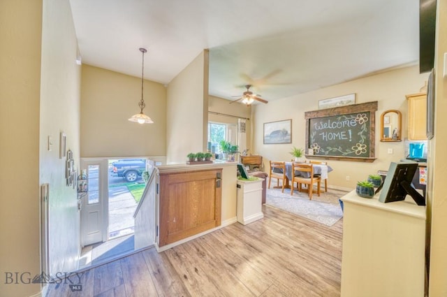 215 N 4th St Unit B, Manhattan, MT 59741 - kitchen featuring light wood finished floors, a ceiling fan, and hanging light fixtures