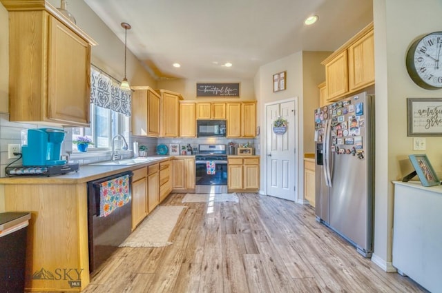 215 N 4th St Unit B, Manhattan, MT 59741 - kitchen with stainless steel appliances, light brown cabinets, light wood finished floors, and recessed lighting