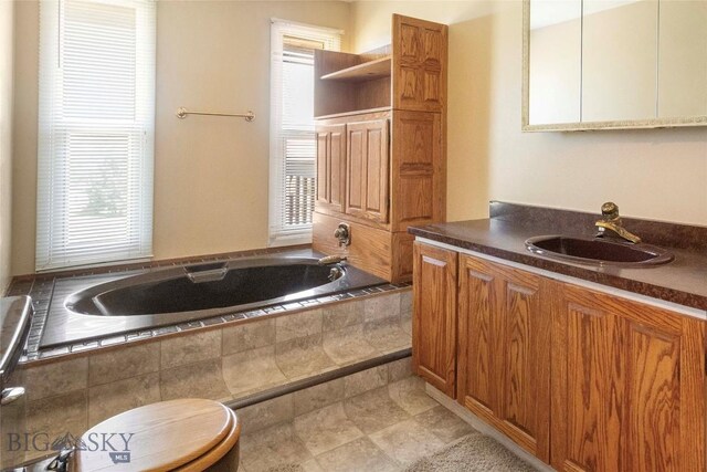 34 Mammoth Dr, Butte, MT 59701 - bathroom with tiled bath and vanity