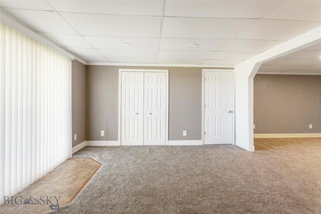 34 Mammoth Dr, Butte, MT 59701 - basement featuring carpet floors, a paneled ceiling, and arched walkways