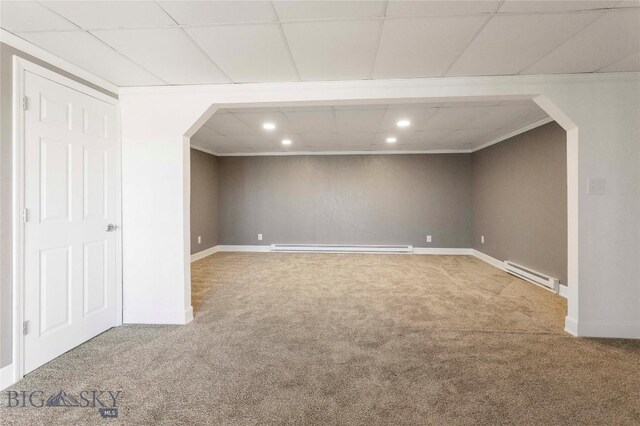 34 Mammoth Dr, Butte, MT 59701 - below grade area featuring baseboard heating, carpet floors, arched walkways, recessed lighting, and crown molding