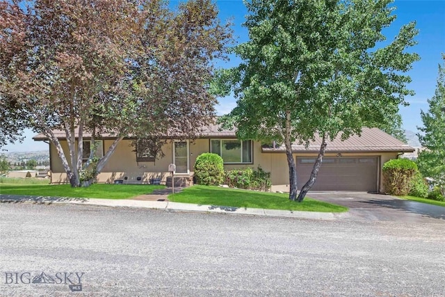 34 Mammoth Dr, Butte, MT 59701 - view of front of home featuring an attached garage, driveway, a front yard, and a metal roof