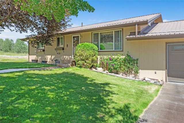 34 Mammoth Dr, Butte, MT 59701 - view of front of home featuring a front yard and a metal roof