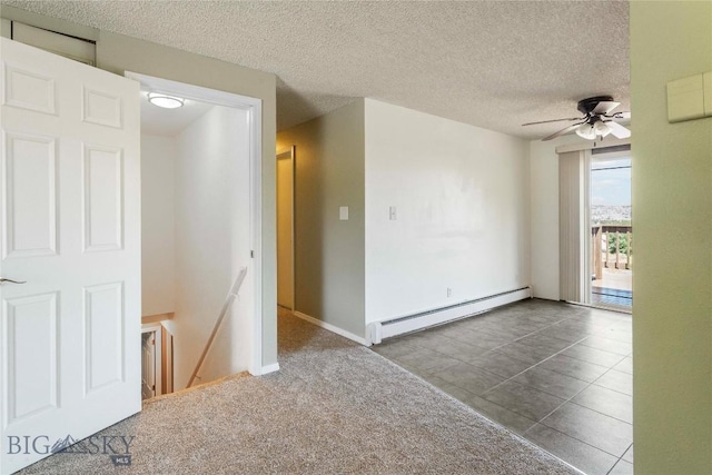 34 Mammoth Dr, Butte, MT 59701 - unfurnished room with a baseboard heating unit, a ceiling fan, and a textured ceiling