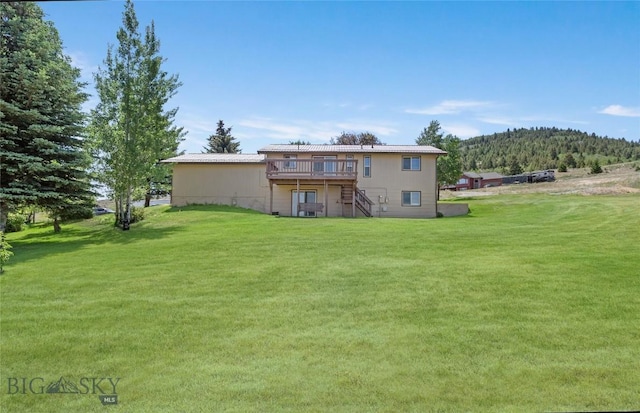 34 Mammoth Dr, Butte, MT 59701 - rear view of property featuring stairway, a wooden deck, and a lawn
