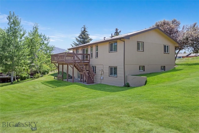 34 Mammoth Dr, Butte, MT 59701 - back of property with stairway, a wooden deck, and a lawn
