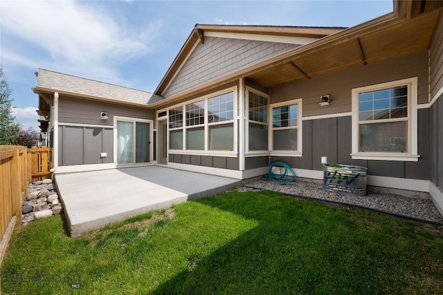 5479 Annie St, Bozeman, MT 59718 - rear view of house featuring a patio area and board and batten siding