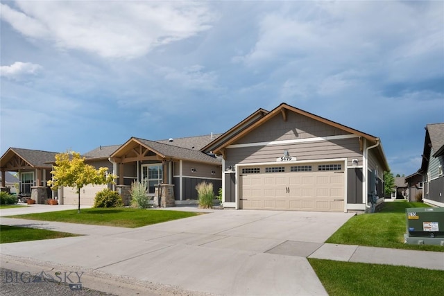 5479 Annie St, Bozeman, MT 59718 - single story home with a garage, concrete driveway, and a front lawn