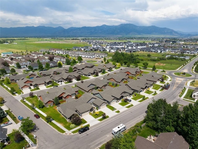 5479 Annie St, Bozeman, MT 59718 - aerial overview of property's location featuring a mountain backdrop and nearby suburban area