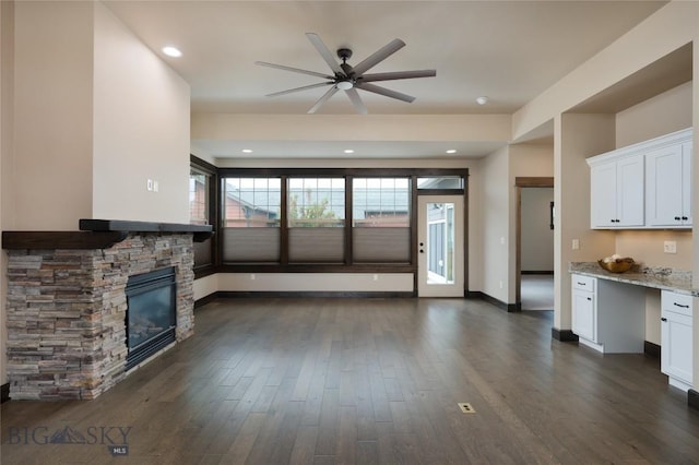5479 Annie St, Bozeman, MT 59718 - unfurnished living room featuring ceiling fan, a fireplace, dark wood-type flooring, and recessed lighting