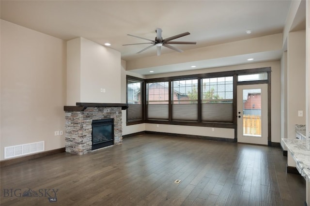 5479 Annie St, Bozeman, MT 59718 - unfurnished living room featuring a ceiling fan, a stone fireplace, dark wood-style flooring, and recessed lighting