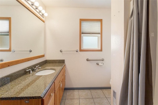 735 10th St, Butte, MT 59701 - bathroom featuring vanity and tile patterned floors