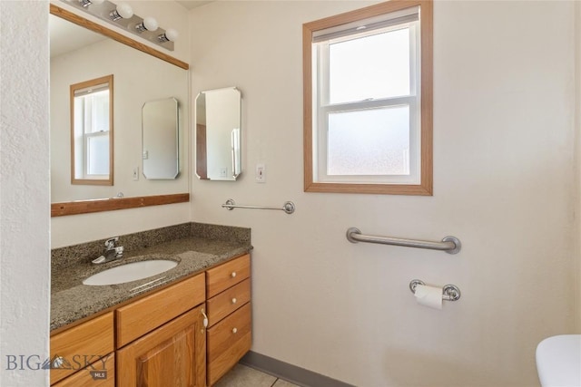 735 10th St, Butte, MT 59701 - bathroom with vanity and toilet