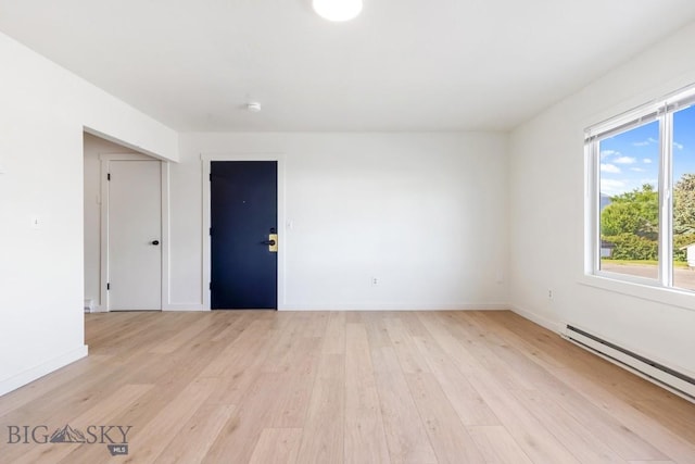 1714 S 19th Ave, Bozeman, MT 59718 - spare room with baseboard heating and light wood-style floors