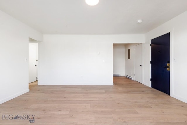 1714 S 19th Ave, Bozeman, MT 59718 - spare room featuring a baseboard radiator, light wood finished floors, and a smoke detector
