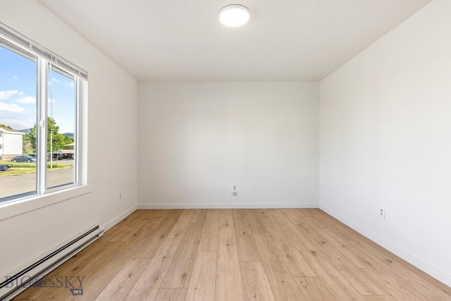 1714 S 19th Ave, Bozeman, MT 59718 - unfurnished room with baseboard heating and light wood-type flooring