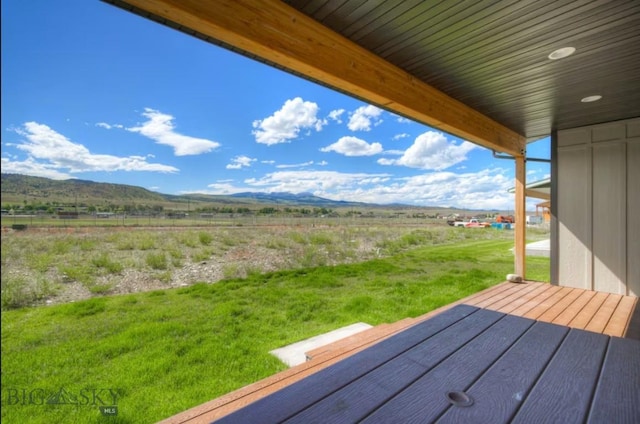 421 Otis Ave, Ennis, MT 59729 - wooden deck with a mountain view, a lawn, and a rural view