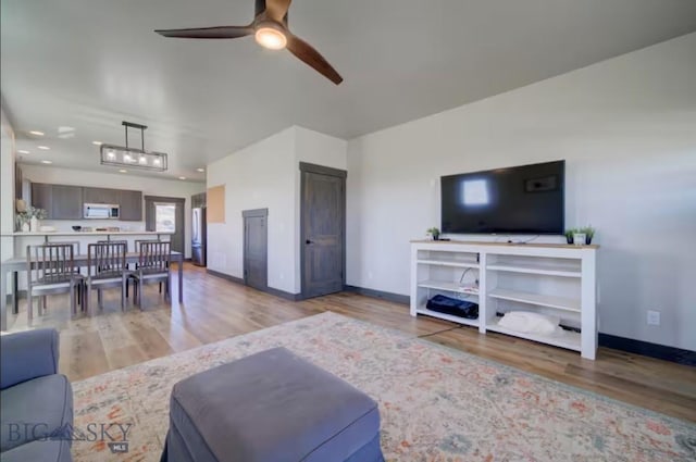 421 Otis Ave, Ennis, MT 59729 - living area featuring a ceiling fan, light wood-style floors, and recessed lighting